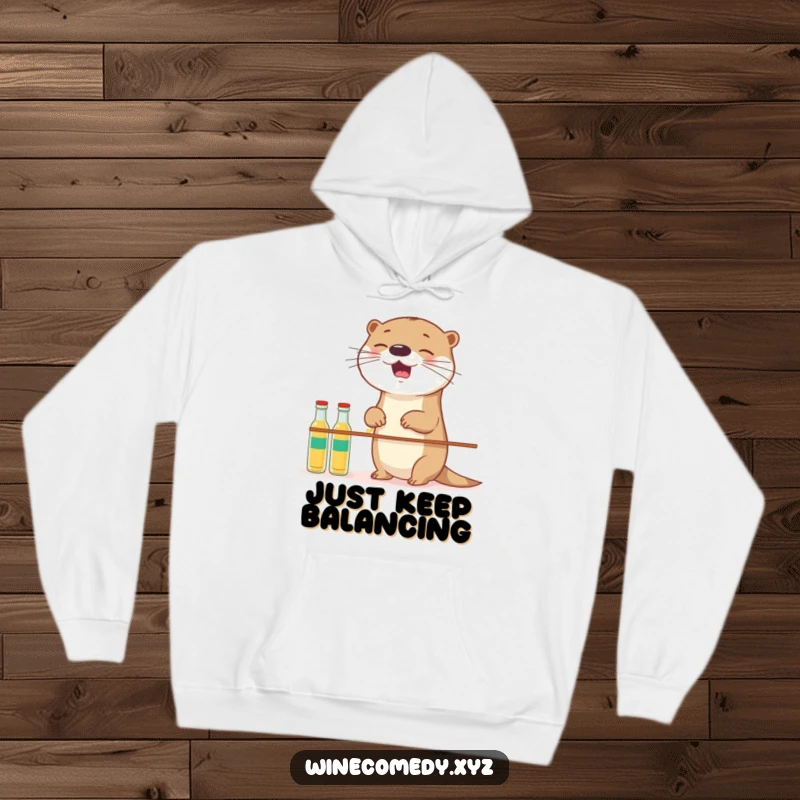 Funny giggling otter attempting to balance small bottles, featured on a warm and cozy hoodie.